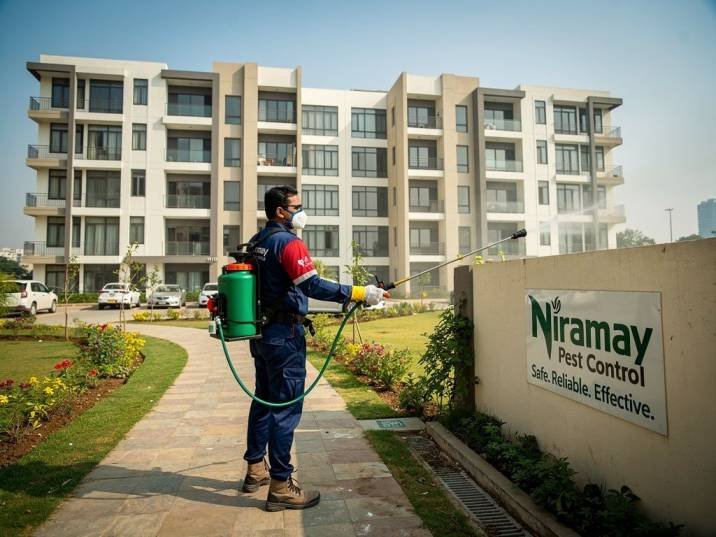 Niramay Pest Control technician treating a residential apartment complex in Gurgaon